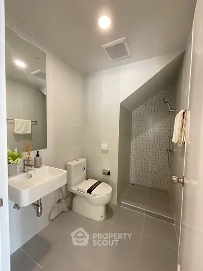 Modern bathroom with sleek design and spacious shower area