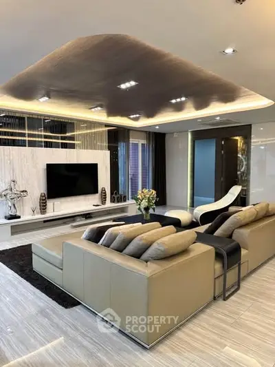 Luxurious modern living room with elegant decor and spacious seating area.