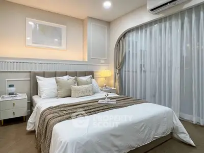 Luxurious bedroom with elegant decor and soft lighting, featuring a cozy bed and stylish furnishings.