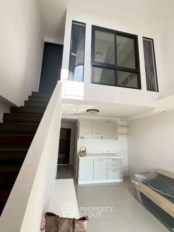 Modern loft apartment with mezzanine and sleek staircase