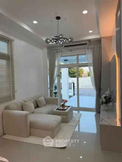 Elegant living room with modern decor and large windows for natural light