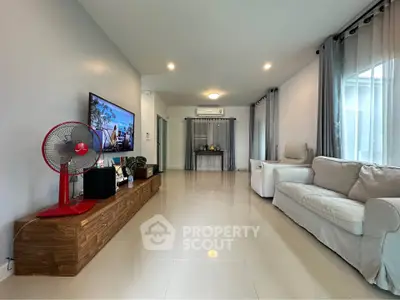 Spacious modern living room with sleek furniture and natural light