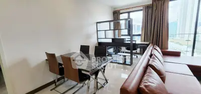 Modern living room with dining area and study desk, featuring large windows and city view.