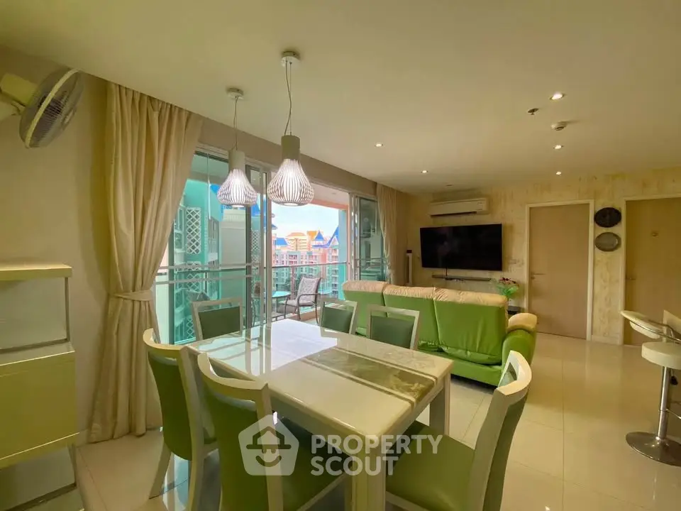 Spacious living room with modern decor and balcony view in a stylish apartment.