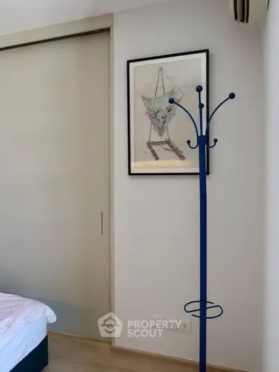 Cozy bedroom corner with modern decor and sliding door