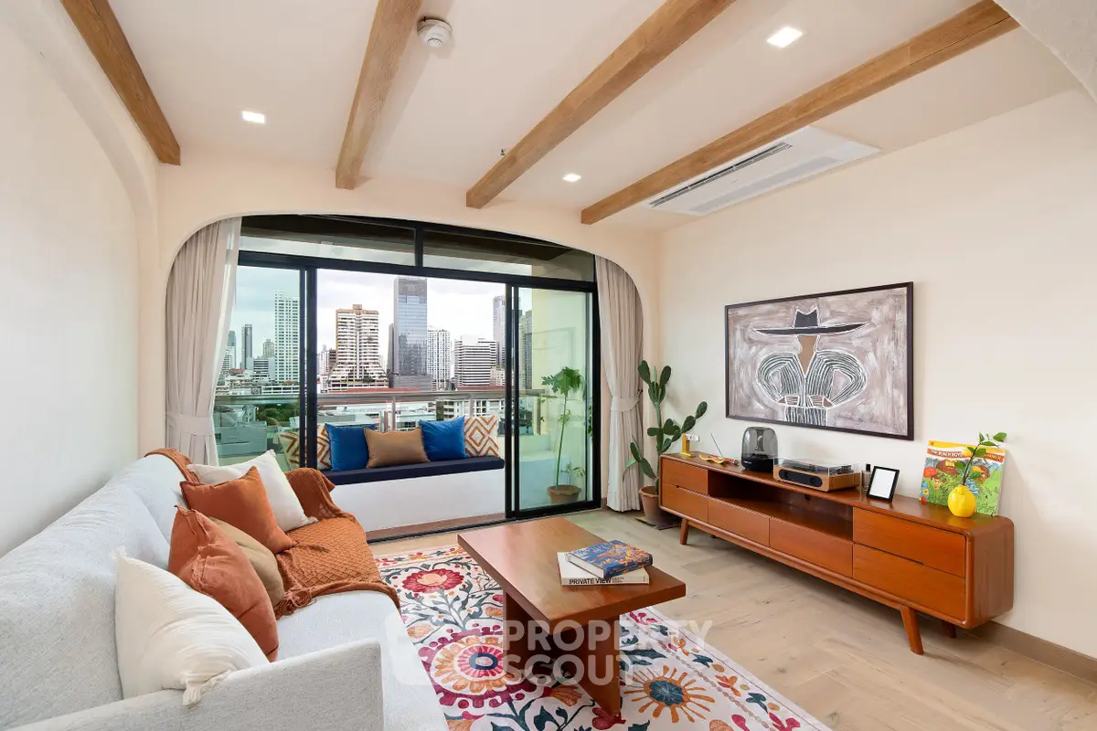Stylish living room with city view, featuring modern decor and cozy seating area.