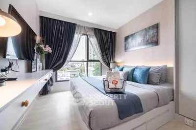 Modern bedroom with elegant decor and large window view