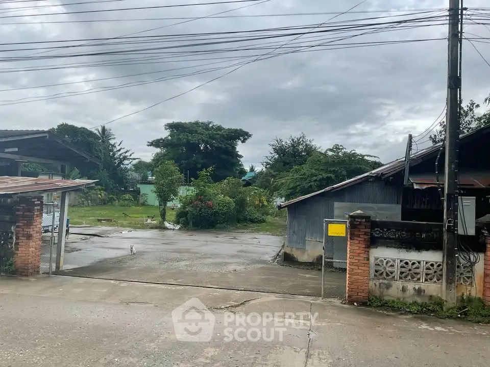 Charming rural property with spacious outdoor area and lush greenery, perfect for serene living.