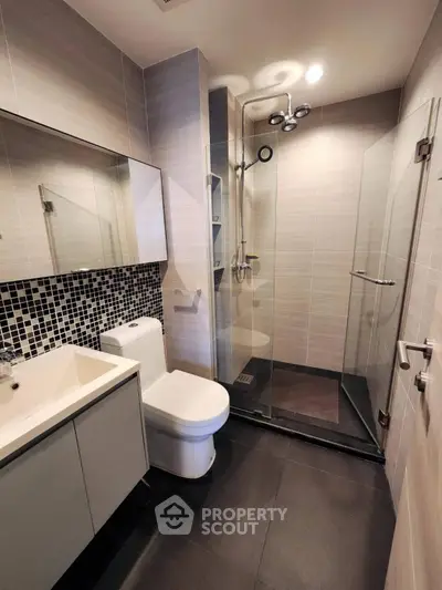 Modern bathroom with sleek shower and stylish tiles