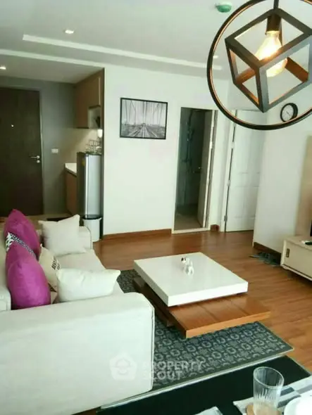 Modern living room with stylish decor and open kitchen layout