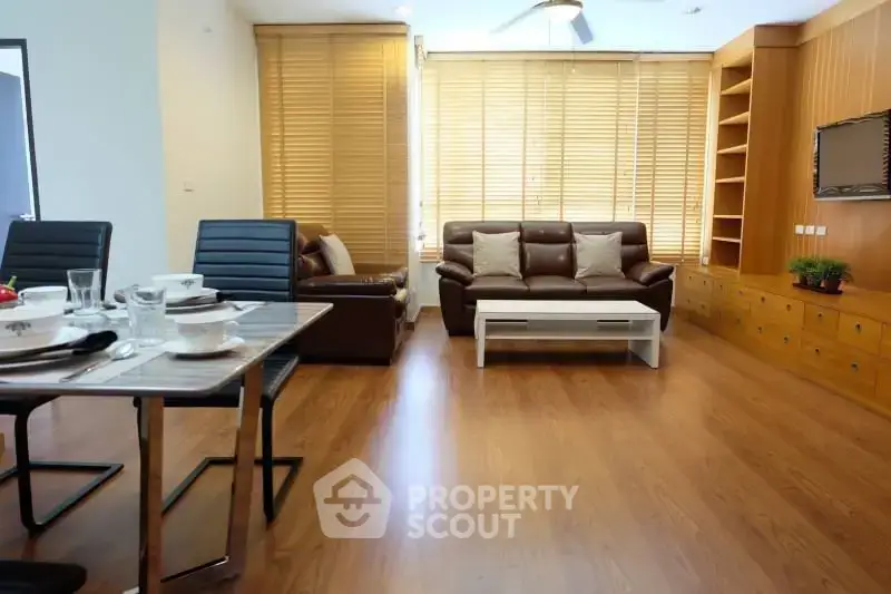 Spacious living room with modern furniture and wooden flooring