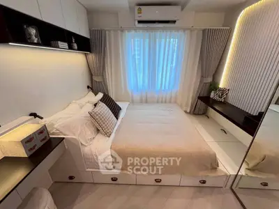 Modern bedroom with stylish decor, built-in storage, and ambient lighting, perfect for cozy living.