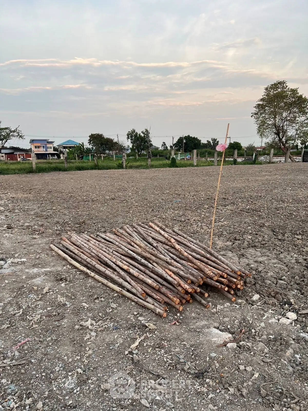 Vacant land with construction materials, ideal for development opportunities.