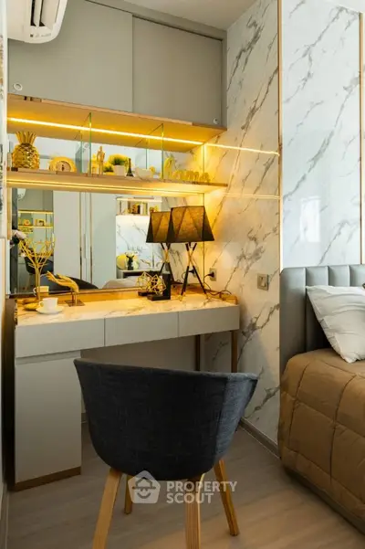 Modern bedroom with stylish decor and marble accent wall