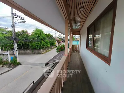 Charming balcony with street view in a serene neighborhood