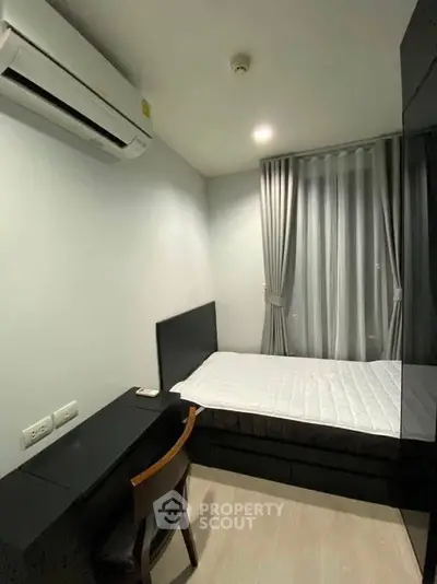 Cozy bedroom with modern furnishings and air conditioning