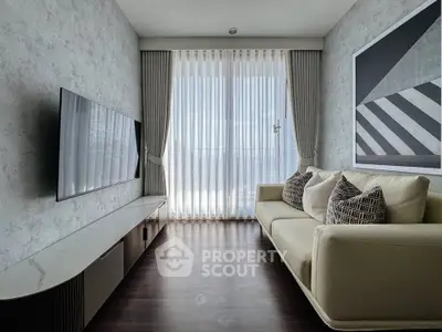Modern living room with sleek design, featuring a wall-mounted TV and elegant sofa, perfect for urban living.