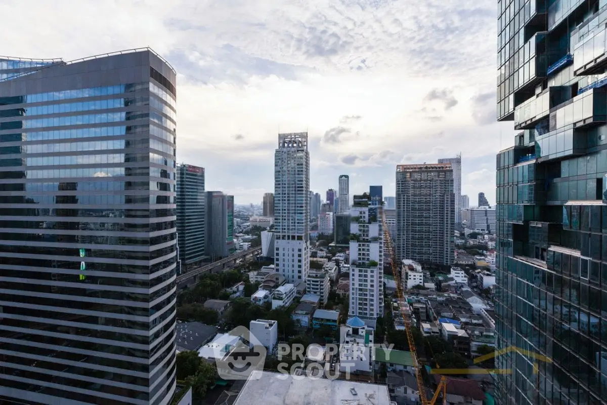 Stunning cityscape view from a high-rise building showcasing modern architecture and urban skyline.