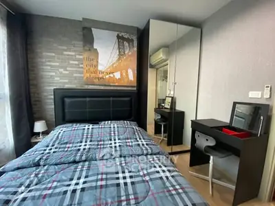 Modern bedroom with stylish decor and mirrored wardrobe