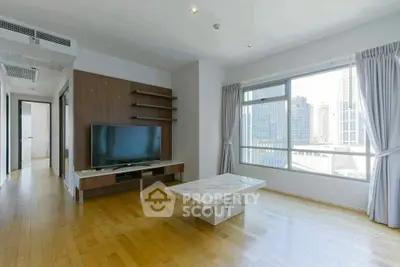 Spacious modern living room with large window and city view