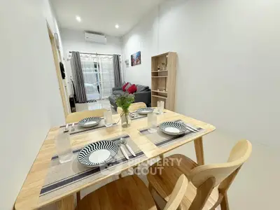 Modern dining area with wooden table set in a cozy living room