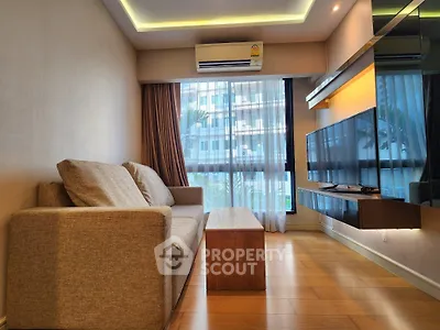 Modern living room with sleek design and large window view