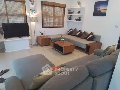 Cozy living room with modern furniture and stylish decor, perfect for relaxation and entertainment.