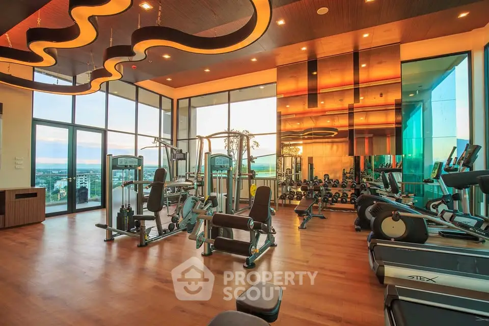 Luxurious gym with modern equipment and panoramic city views