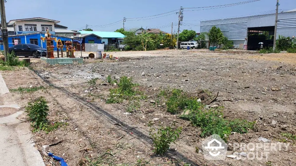 Vacant land plot for sale in developing neighborhood with potential for residential or commercial use.