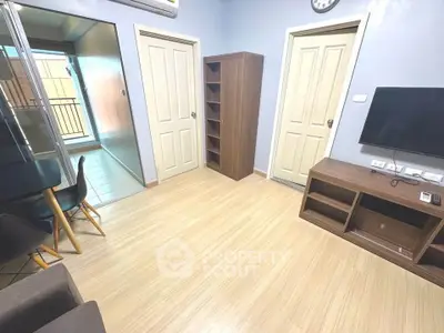 Modern living room with sleek furniture and natural light, perfect for cozy gatherings.