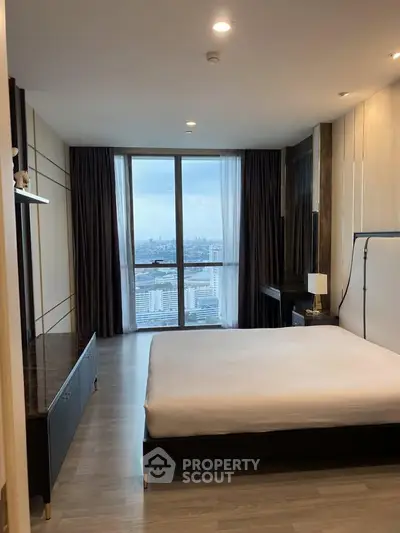 Luxurious bedroom with stunning city view and modern decor