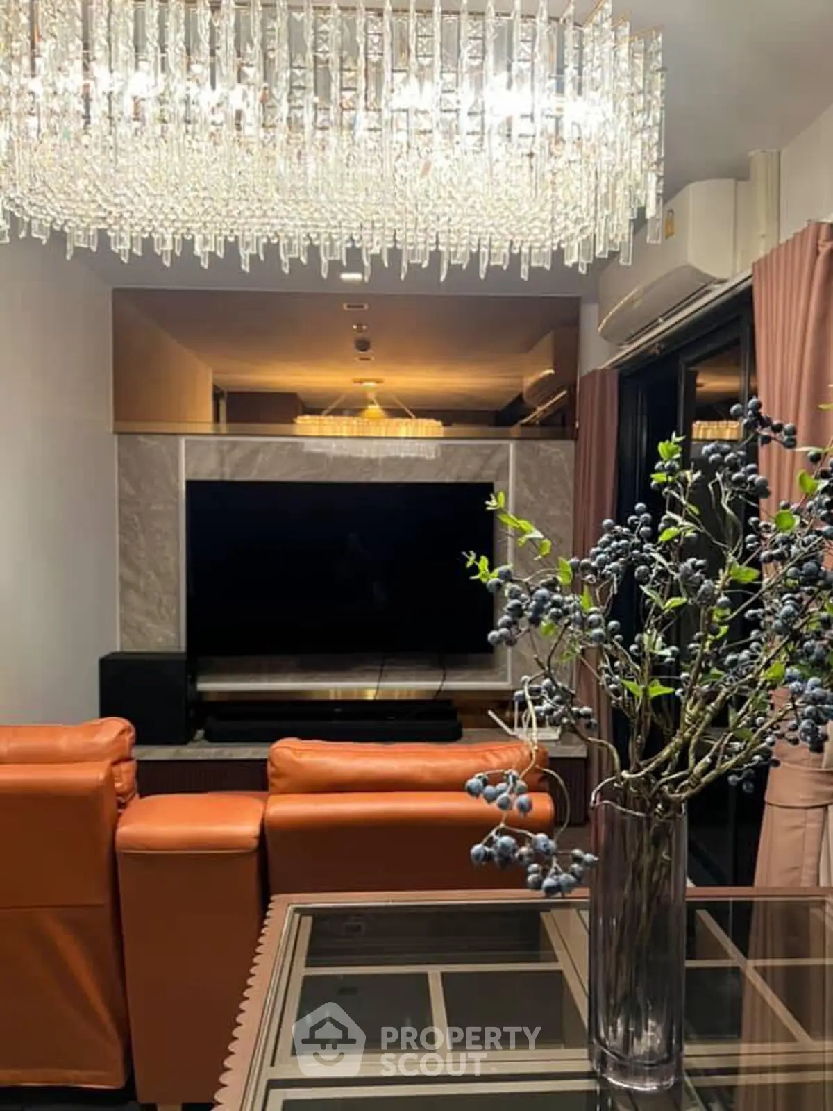 Luxurious living room with elegant chandelier and modern decor