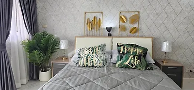 Luxurious bedroom with elegant decor and modern furnishings for a serene living experience.