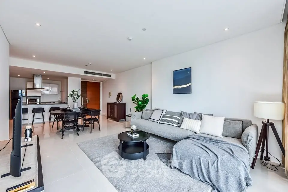 Spacious modern living room with open kitchen and stylish decor