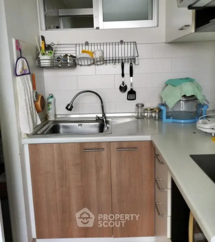 Compact kitchen with modern fixtures and efficient storage solutions