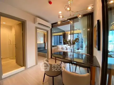 Luxurious modern apartment with open living and dining area, featuring elegant decor and city views.