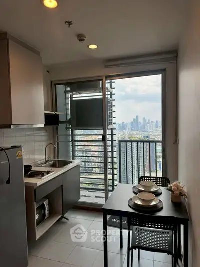 Modern kitchen with city view from balcony in high-rise apartment