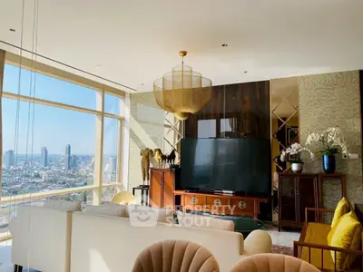 Luxurious living room with panoramic city view, elegant decor, and plush seating in high-rise apartment.