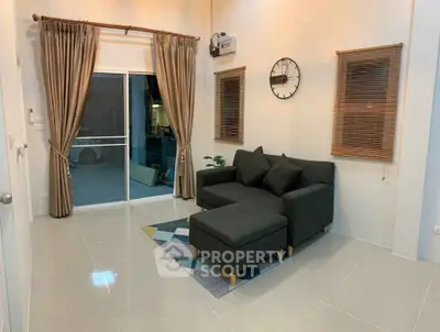 Modern living room with stylish sofa and elegant curtains