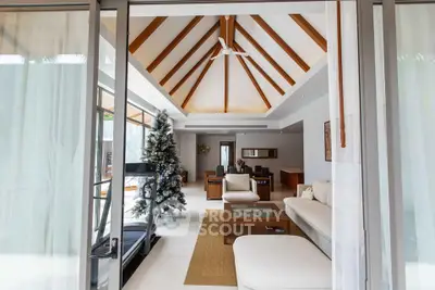 Luxurious living room with vaulted ceiling and modern decor