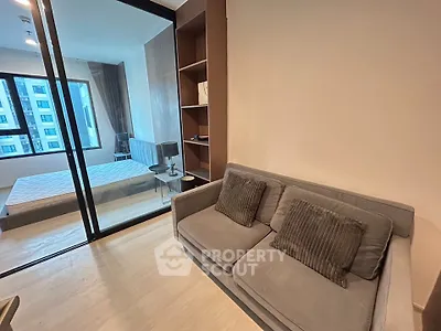 Modern apartment interior with cozy living room and stylish bedroom view.