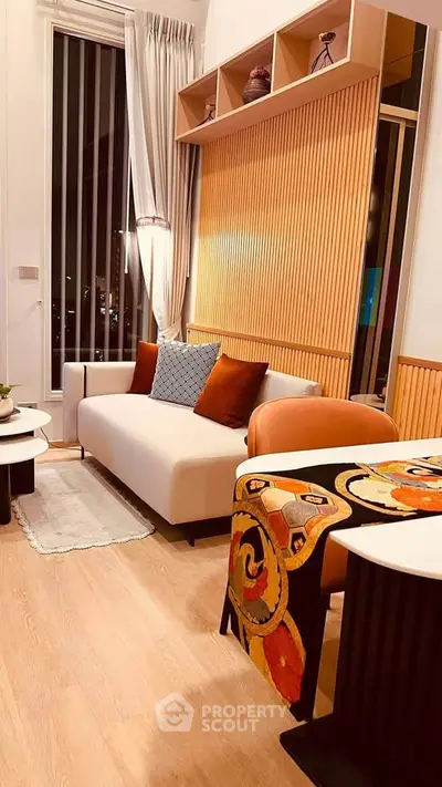 Stylish modern living room with elegant decor and cozy seating area.