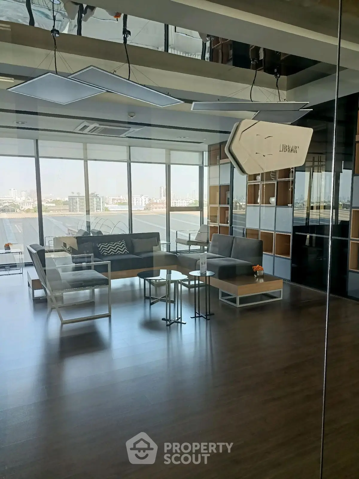 Modern living room with panoramic city view and stylish furniture