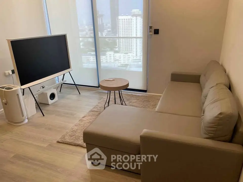 Modern living room with sleek furniture and city view, perfect for urban living.
