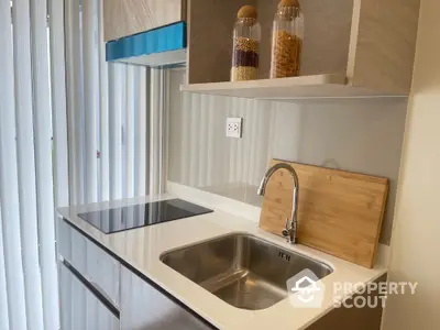 Modern kitchen with sleek countertop and built-in electric stove