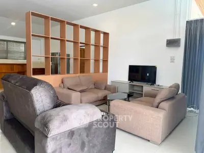Spacious living room with modern furniture and open layout