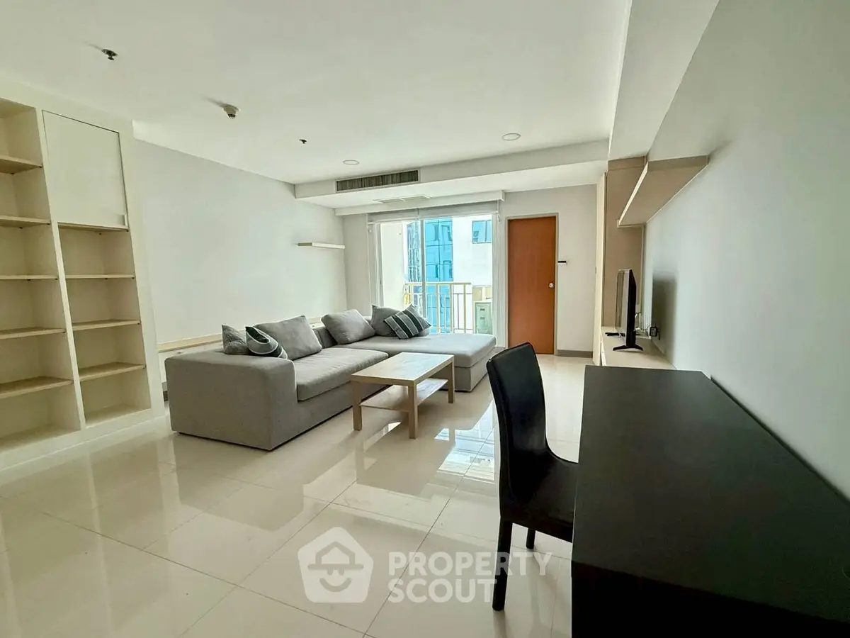 Spacious modern living room with sleek furniture and natural light