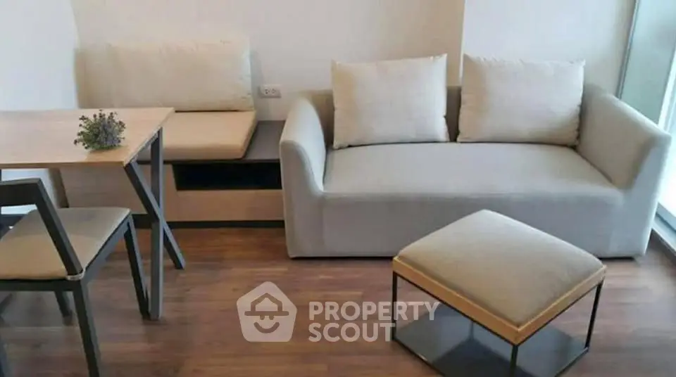 Cozy modern living room with stylish furniture and wooden flooring