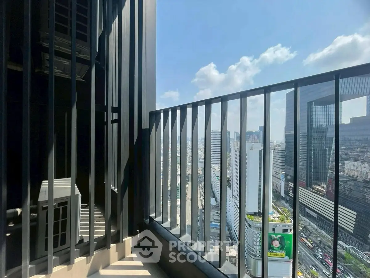 Stunning high-rise balcony with panoramic city views and modern railing design.