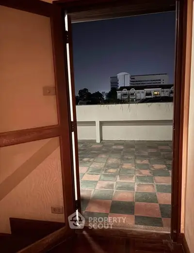 Spacious balcony with city view, perfect for relaxation and entertaining guests.